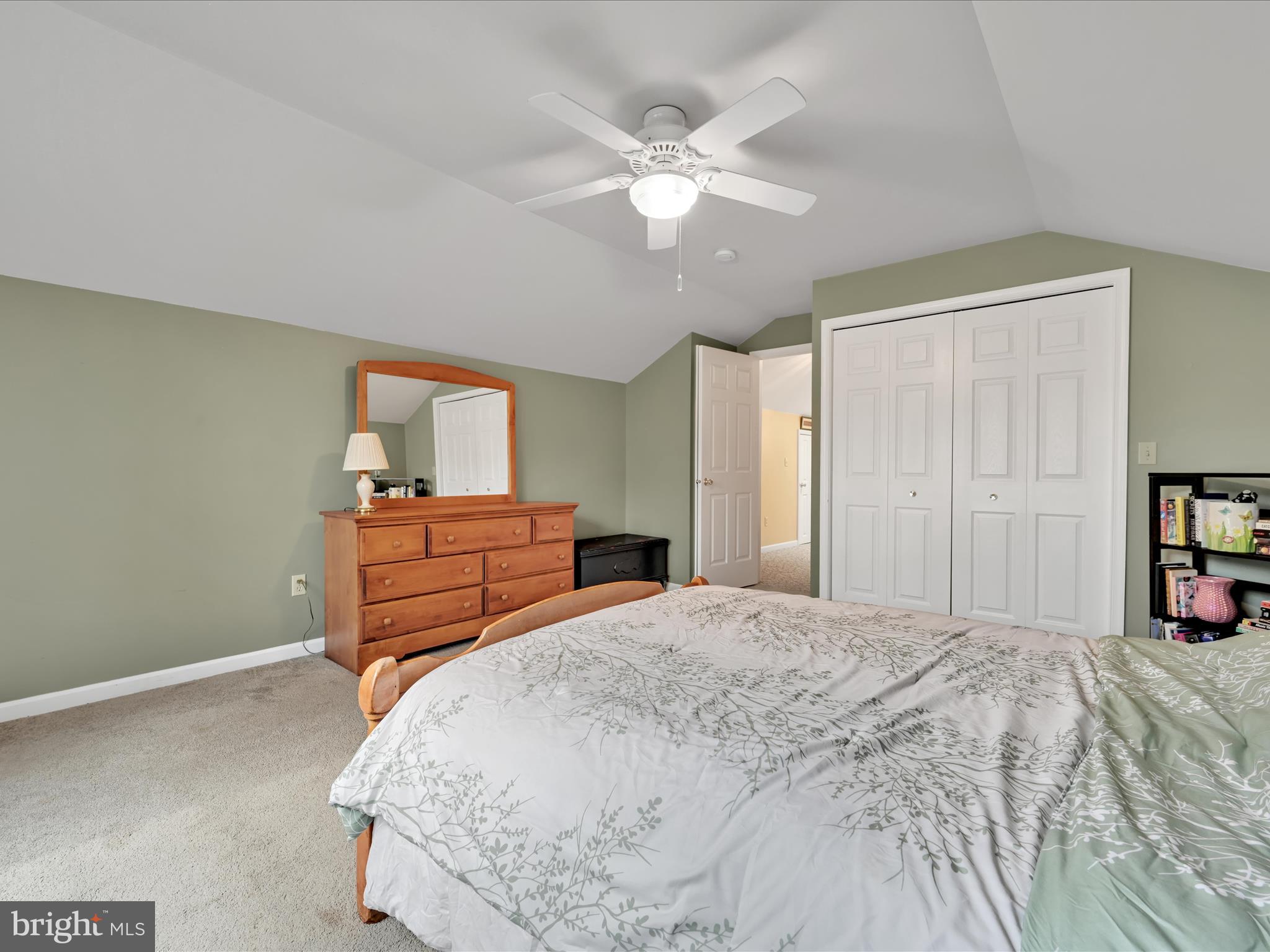 21 Silver Creek Road Lititz, PA 17543 - Photo 32 of 37 a bedroom with a large bed and a chandelier