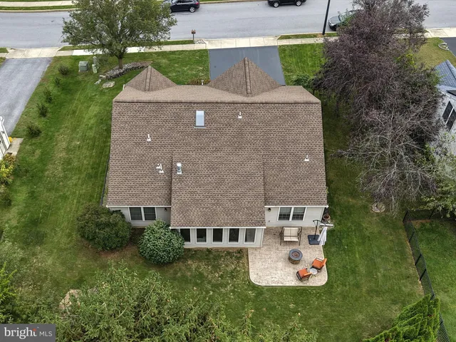 an aerial view of a house with outdoor space