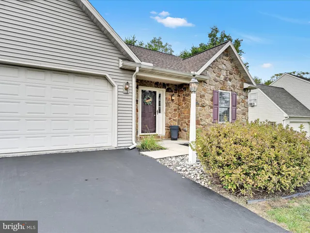 a view of a house with a street