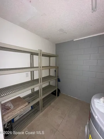 a view of room with racks on the wall
