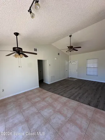 a view of a big room with carpet