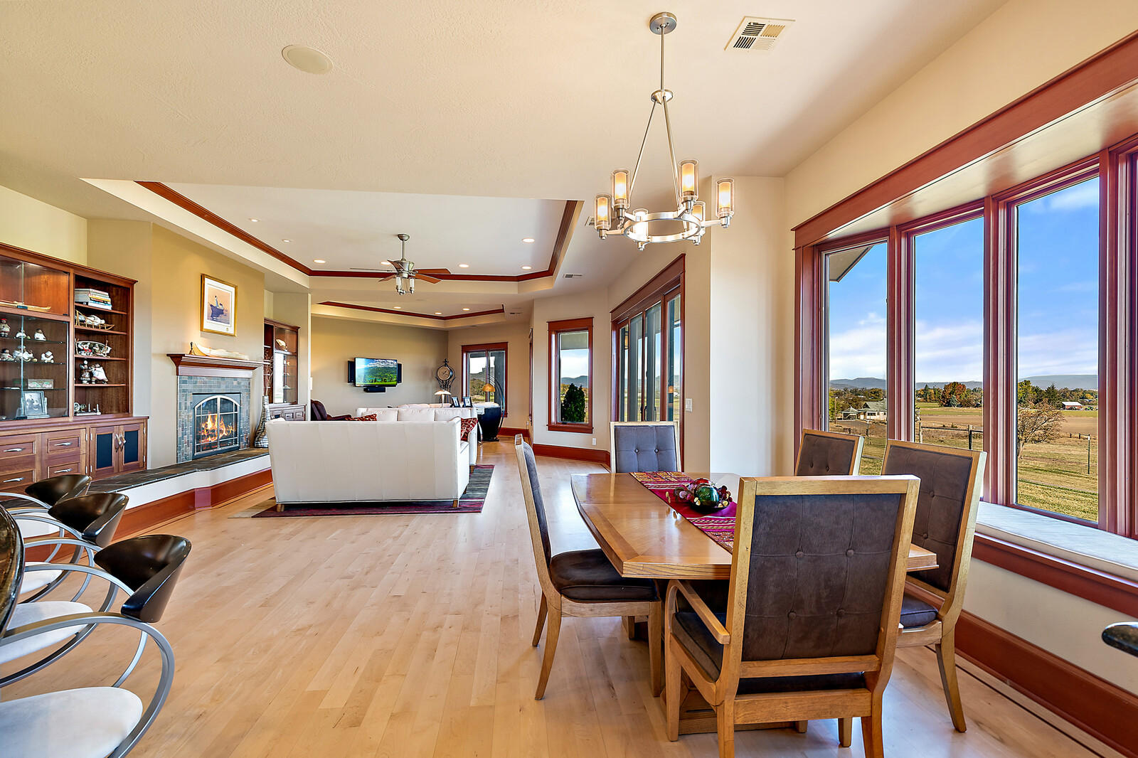 5405-5413 Seven Oaks Road Central Point, OR 97502 - Photo 32 of 65 a living room with furniture a flat screen tv and a floor to ceiling window