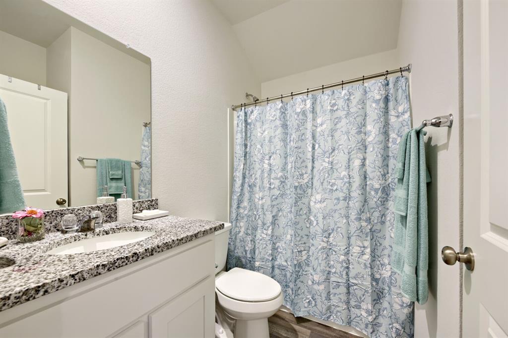 420 Jameson Springtown, TX 76082 - Photo 15 of 29 a bathroom with a granite countertop sink and a mirror