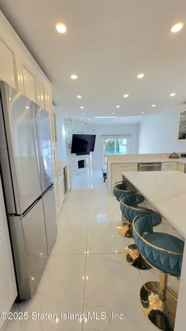 a kitchen with a sink a stove and refrigerator