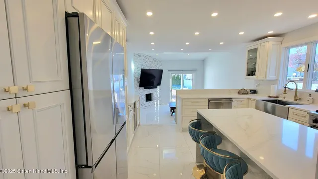 a kitchen with a sink stove and refrigerator