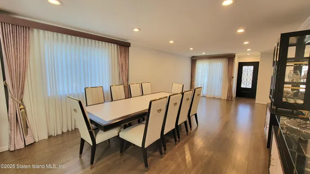 a view of a kitchen with a sink and a refrigerator