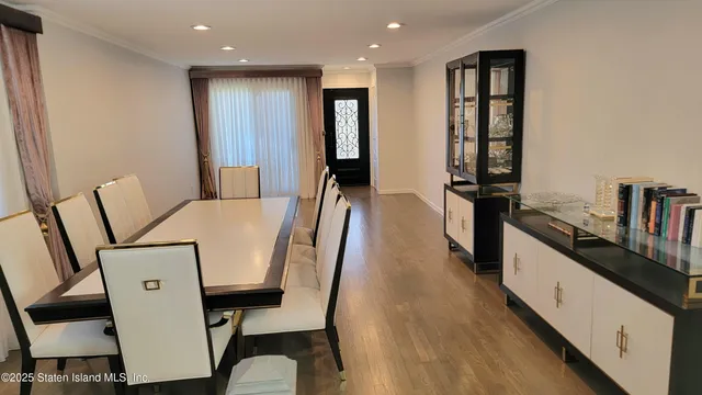 a kitchen with a sink a refrigerator and a stove top oven