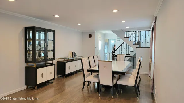 a kitchen with stainless steel appliances a stove a sink a microwave a refrigerator and cabinets