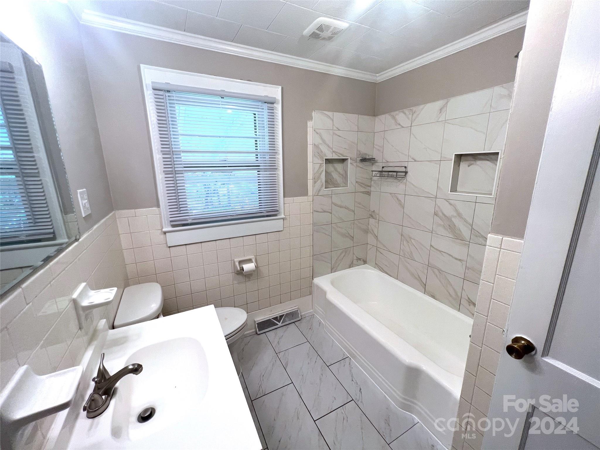 645 Bostian Road China Grove, NC 28023 - Photo 10 of 17 a bathroom with a sink a toilet and shower