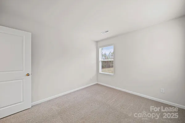 a view of a room that has a window in it