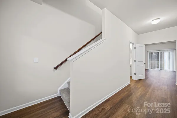 a view of entryway with wooden floor