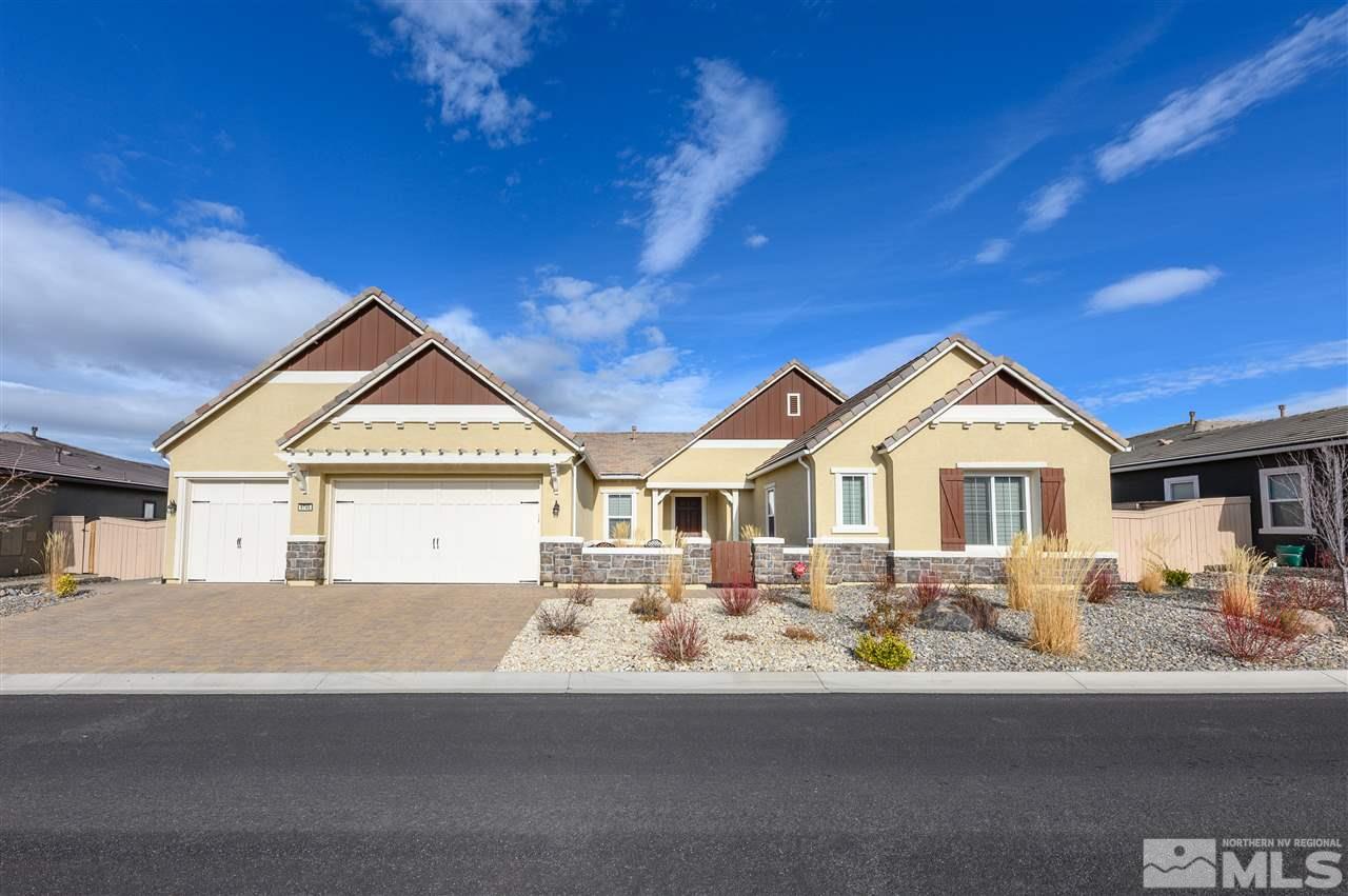 9745 Cardigan Bay Lane Reno, NV 89521 - Photo 1 of 25 a front view of a house with a yard