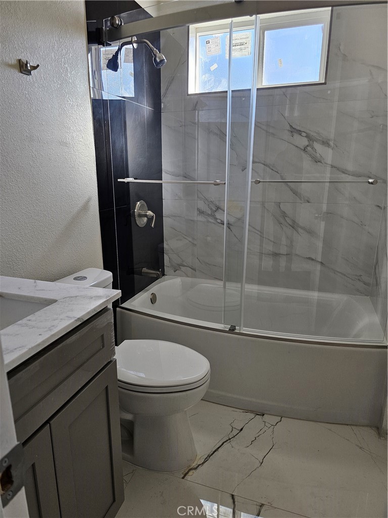 8630 Sahara Road Phelan, CA 92371 - Photo 15 of 21 a bathroom with a toilet and a shower