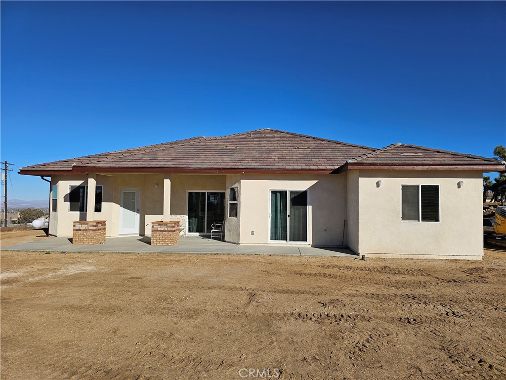 8630 Sahara Road Phelan, CA 92371 - Photo 19 of 21 a view of a house with a backyard