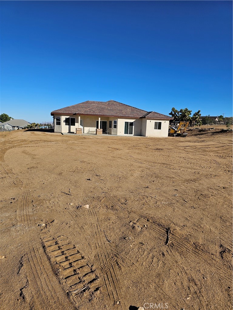 8630 Sahara Road Phelan, CA 92371 - Photo 20 of 21 a front view of a house with a yard