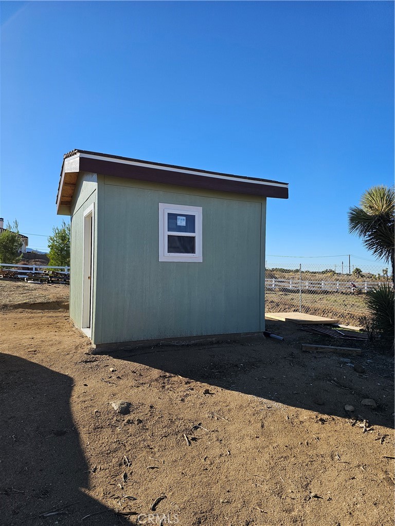 8630 Sahara Road Phelan, CA 92371 - Photo 21 of 21 a view of a house with a yard
