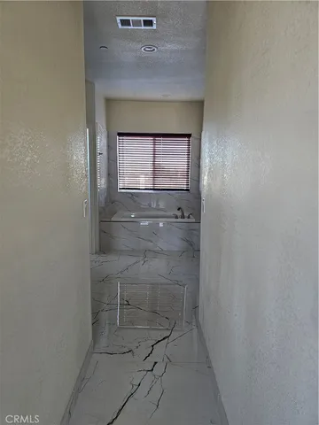 a hallway with washer and dryer