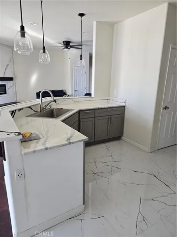 a kitchen with a sink and cabinets
