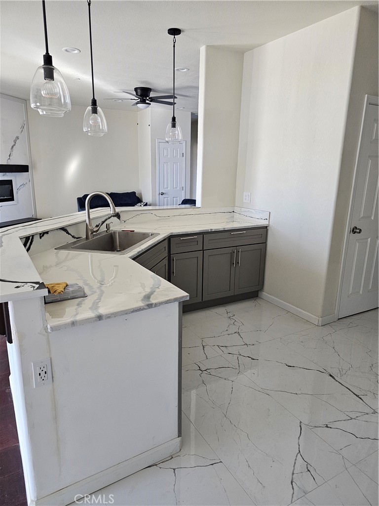 8630 Sahara Road Phelan, CA 92371 - Photo 6 of 21 a kitchen with a sink and cabinets