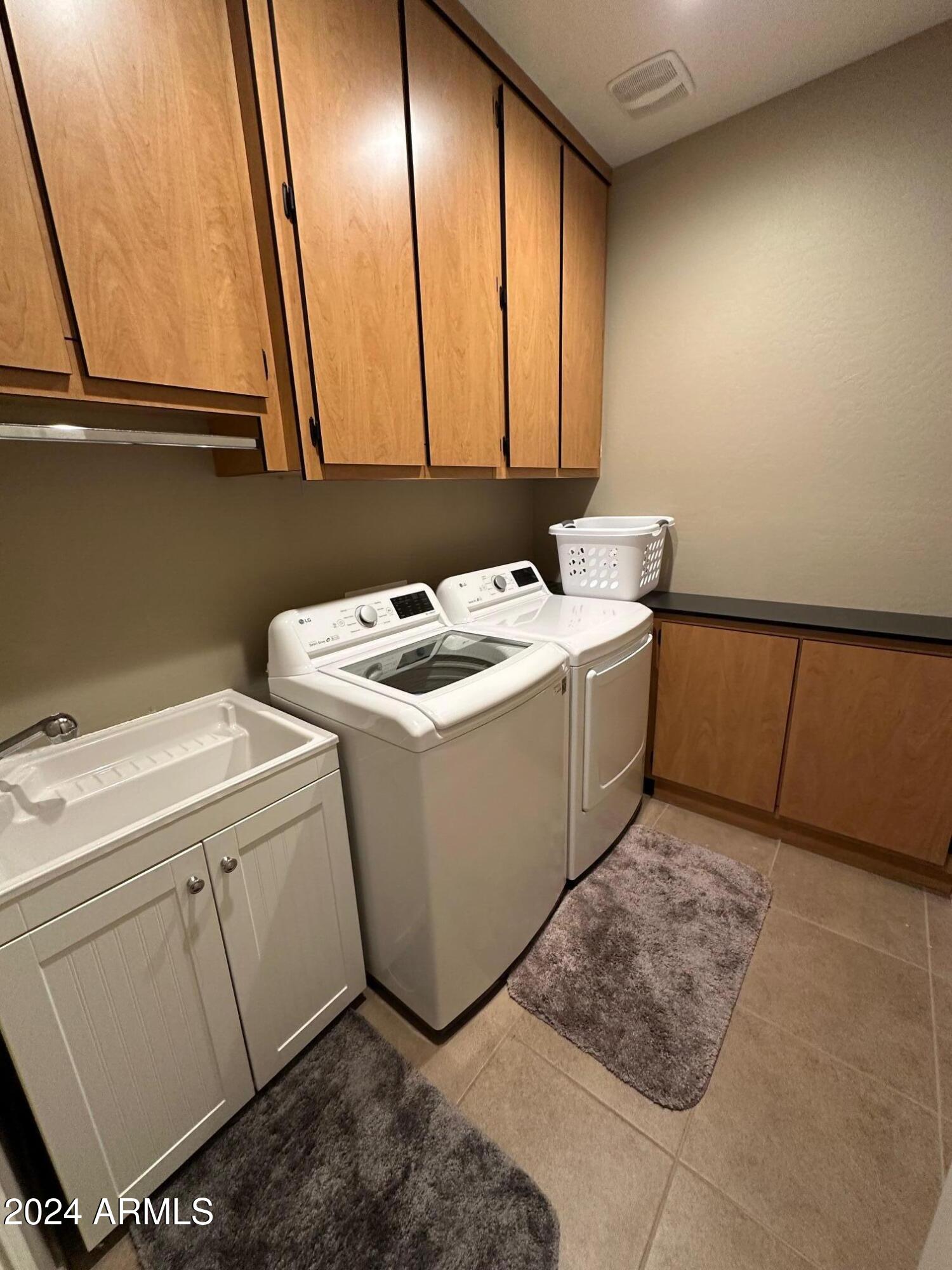 22469 East Camina Plata Queen Creek, AZ 85142 - Photo 12 of 38 a utility room with dryer and washer
