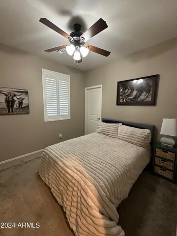a bedroom with bed and window