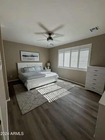 a bedroom with a bed and a cabinets