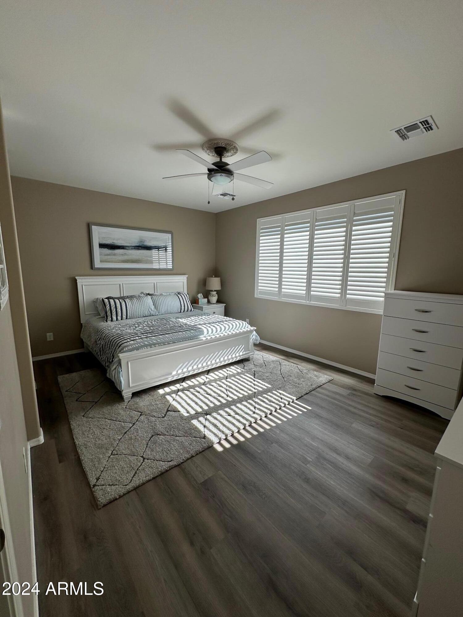 22469 East Camina Plata Queen Creek, AZ 85142 - Photo 18 of 38 a bedroom with a bed and a window