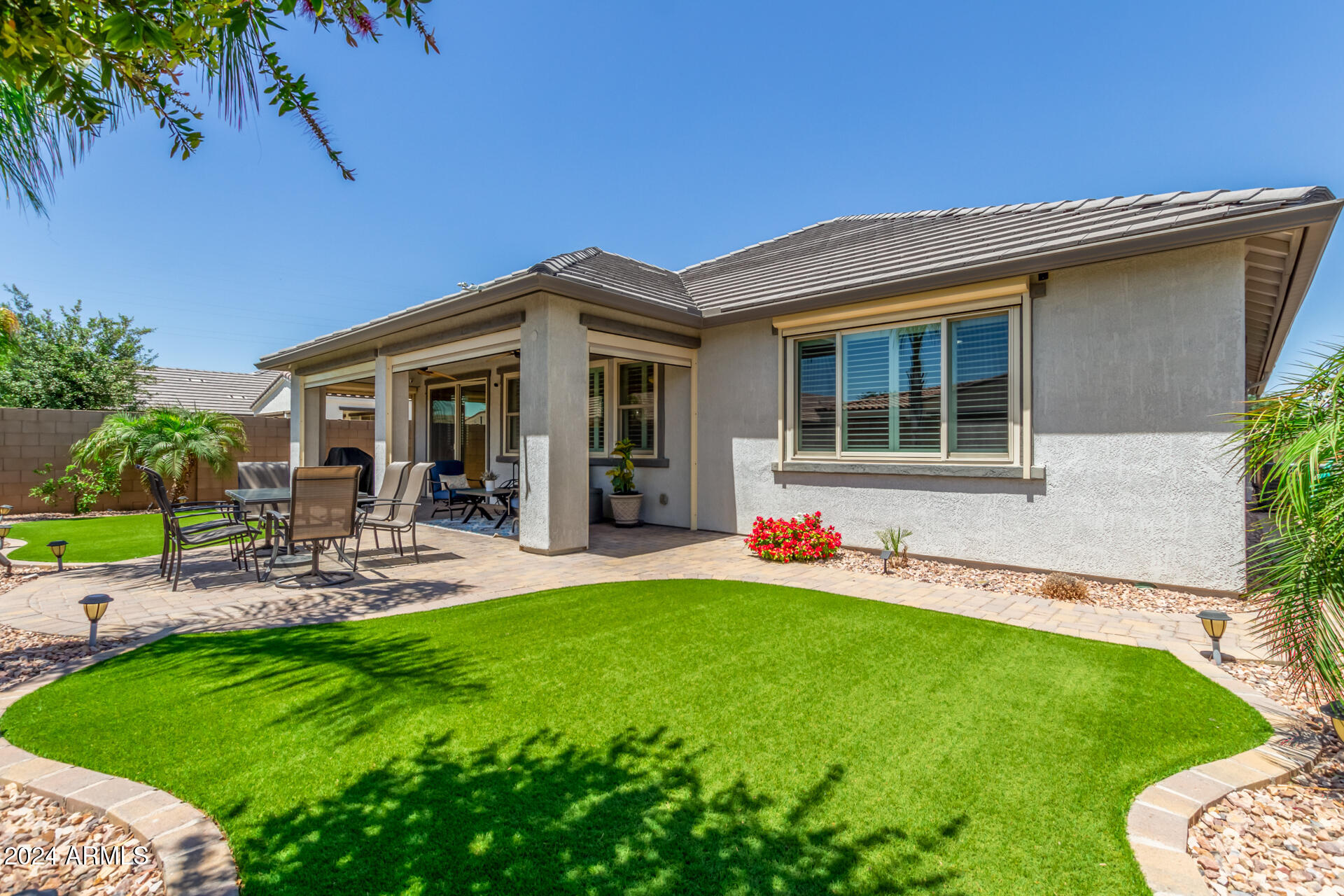 22469 East Camina Plata Queen Creek, AZ 85142 - Photo 27 of 38 a view of a house with a yard and sitting area