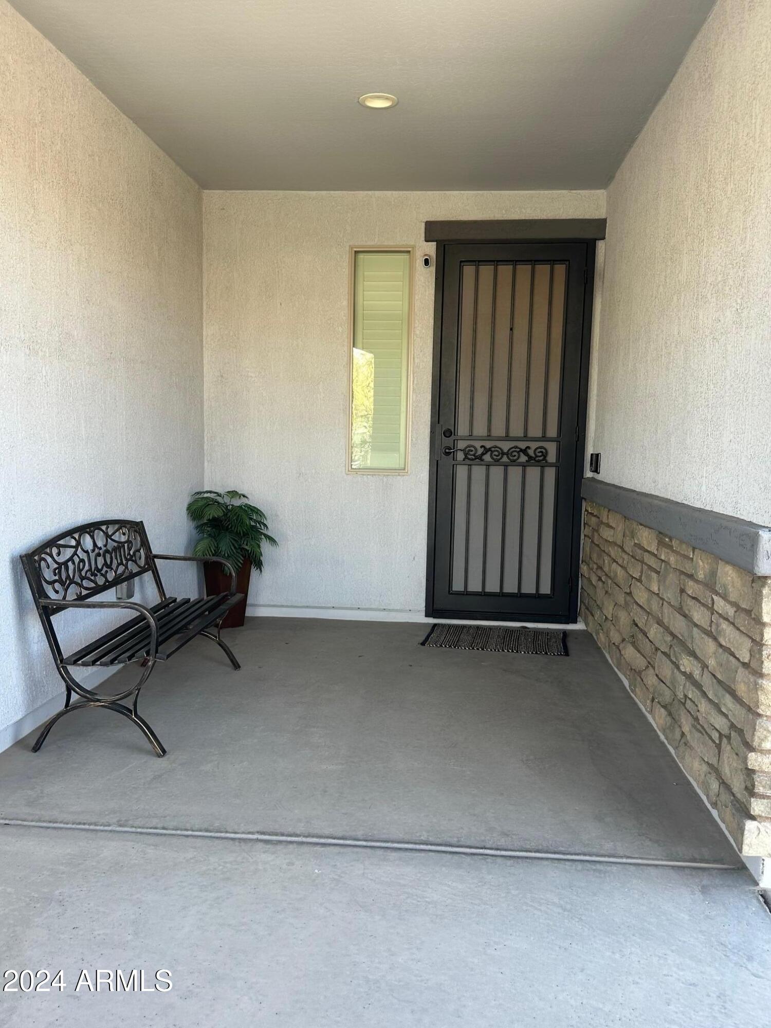 22469 East Camina Plata Queen Creek, AZ 85142 - Photo 5 of 38 a view of workspace with a couch and a potted plant