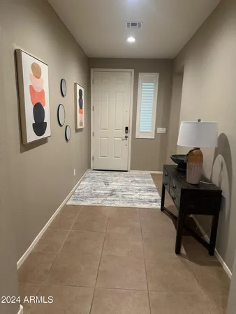 a living room with stainless steel appliances kitchen island granite countertop a refrigerator a stove a sink a dining table and chairs