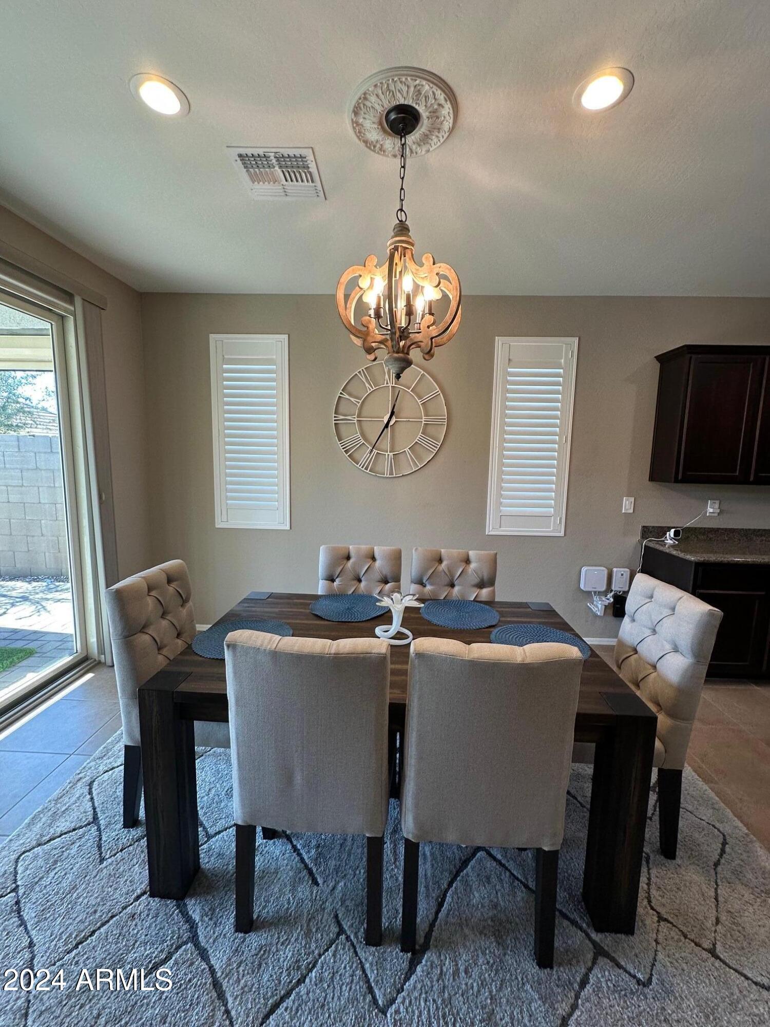 22469 East Camina Plata Queen Creek, AZ 85142 - Photo 9 of 38 a view of a dining room with furniture