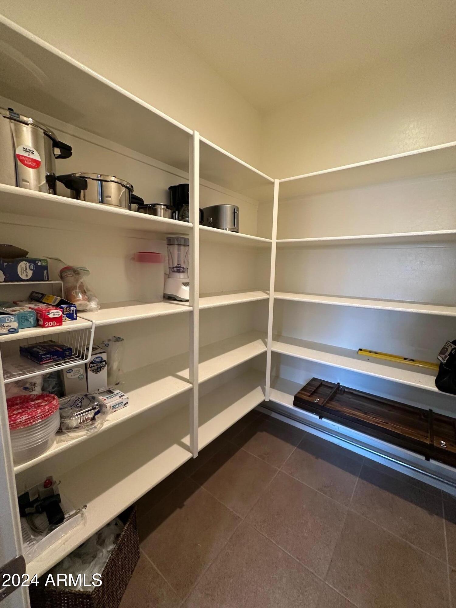 22469 East Camina Plata Queen Creek, AZ 85142 - Photo 10 of 38 a view of walk in closet with empty racks