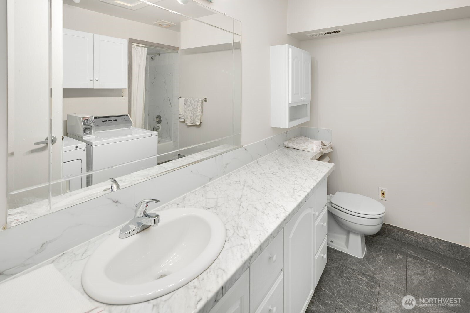 2367 South Forest Street Seattle, WA 98144 - Photo 14 of 33 a bathroom with a granite countertop sink a toilet and a mirror
