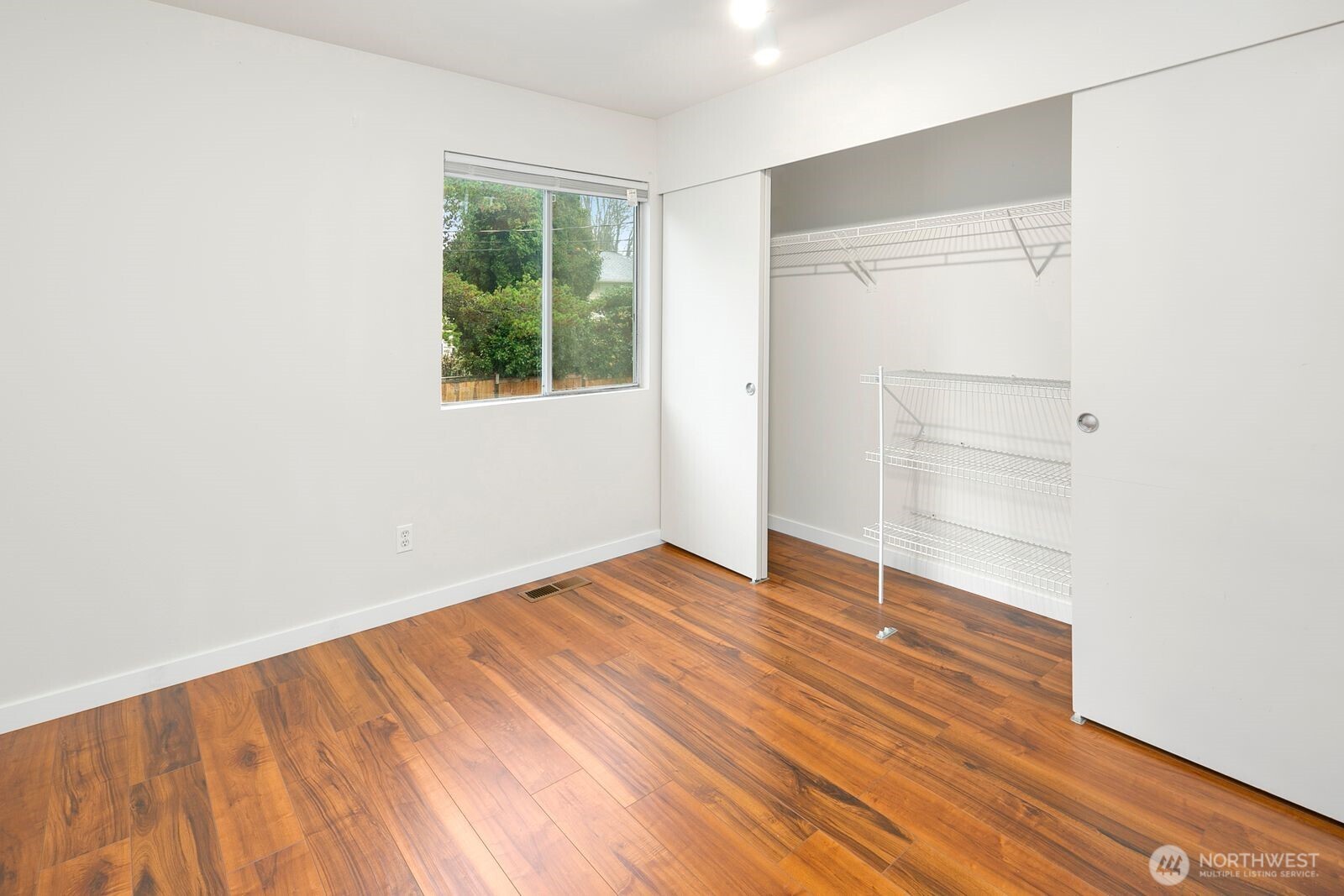 2367 South Forest Street Seattle, WA 98144 - Photo 23 of 33 an empty room with wooden floor and windows