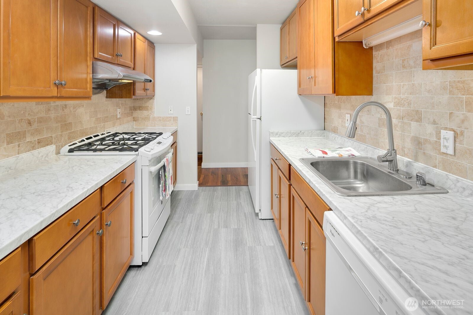 2367 South Forest Street Seattle, WA 98144 - Photo 4 of 33 a kitchen with a sink stove top oven and refrigerator