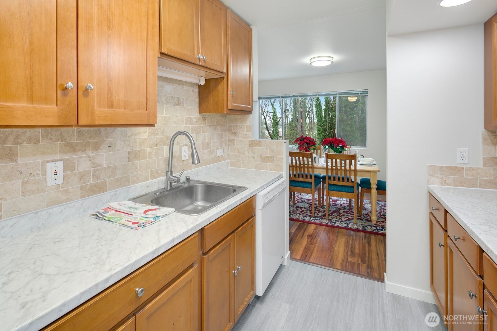 2367 South Forest Street Seattle, WA 98144 - Photo 5 of 33 a kitchen with stainless steel appliances granite countertop a sink stove and cabinets