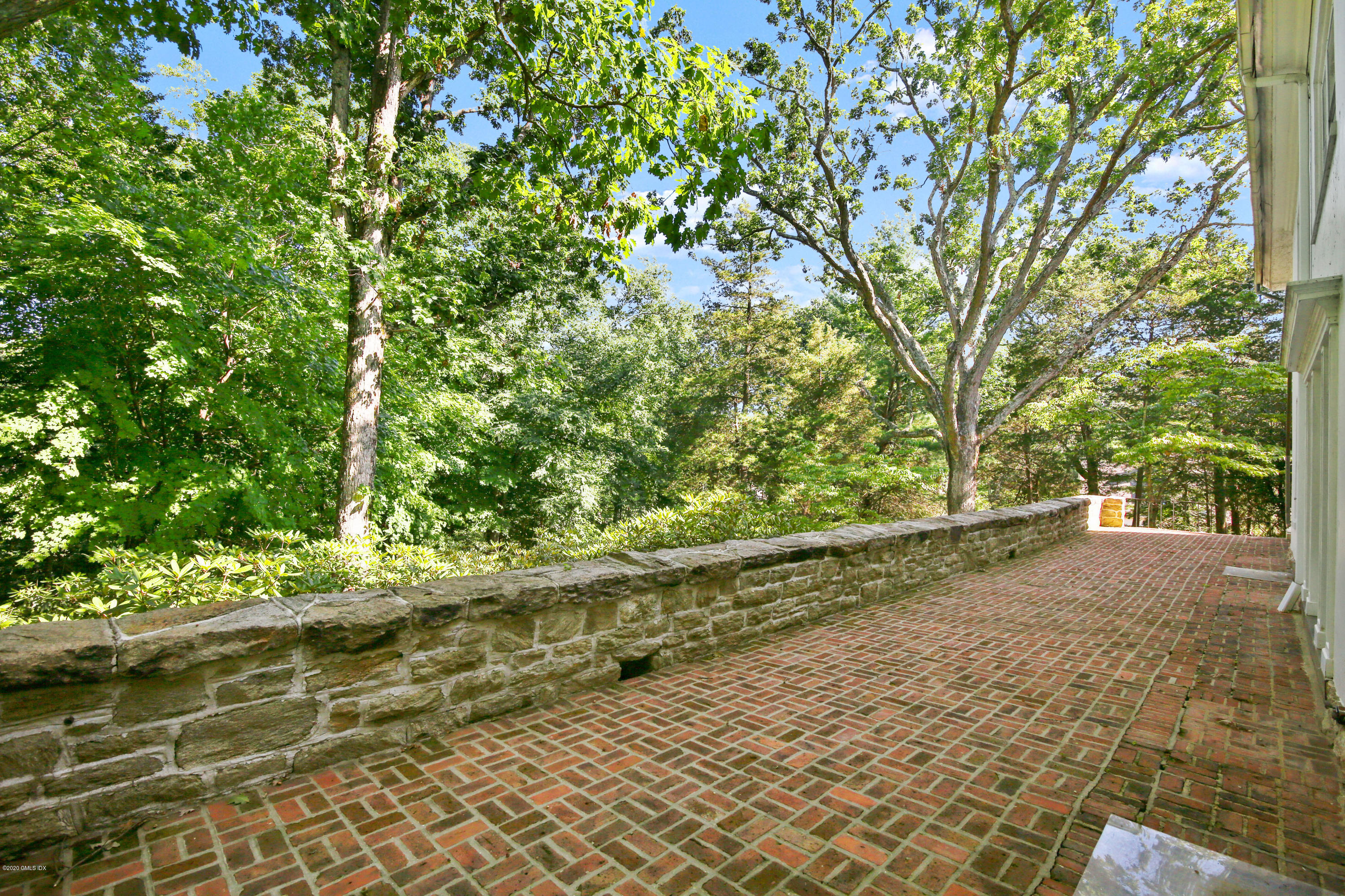 51 Doubling Road Greenwich, CT 06830 - Photo 16 of 24 a view of a yard with plants and large trees