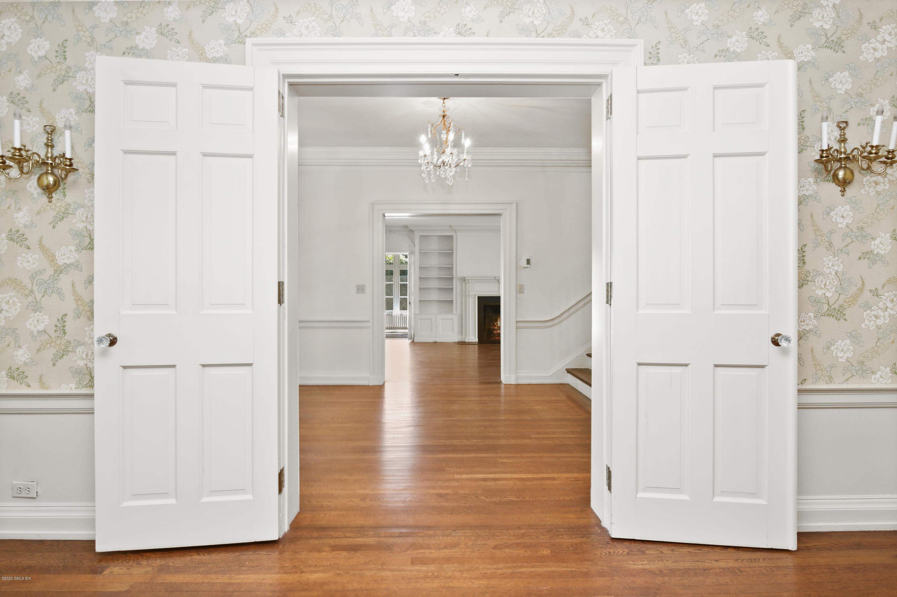 51 Doubling Road Greenwich, CT 06830 - Photo 6 of 24 a view of a hallway with wooden floor and staircase