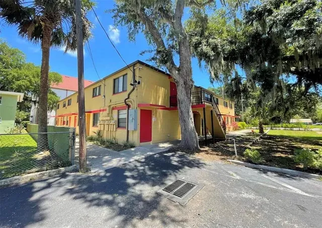 a view of a street with a building in the background