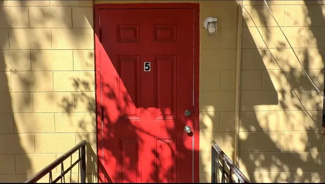 a view of an empty room and window
