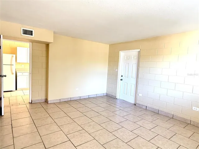 a view of an empty room and window