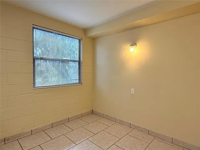 a kitchen with cabinets appliances a sink and a counter top space