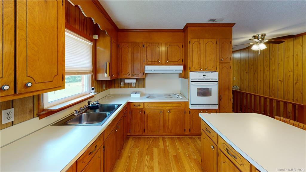 3591 Hughes Road Clover, SC 29710 - Photo 6 of 40 a kitchen with a sink a counter top space and stainless steel appliances