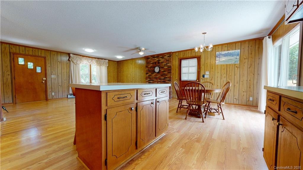 3591 Hughes Road Clover, SC 29710 - Photo 7 of 40 a view of a dining room with furniture window and wooden floor