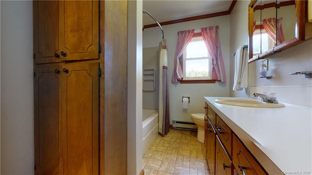 3591 Hughes Road Clover, SC 29710 - Photo 8 of 40 a bathroom with a sink a toilet and a mirror