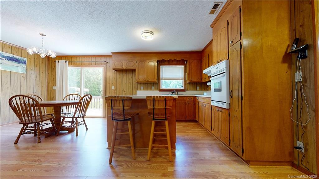 3591 Hughes Road Clover, SC 29710 - Photo 9 of 40 a view of a dining room with furniture and wooden floor