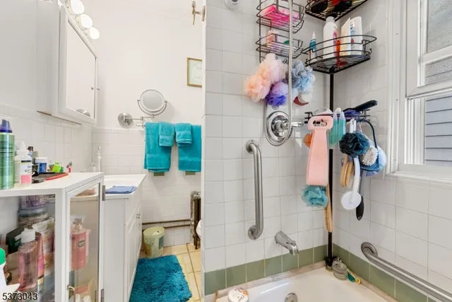 a bathroom with a sink mirror and vanity