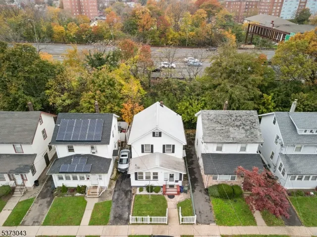 an aerial view of a house with a garden