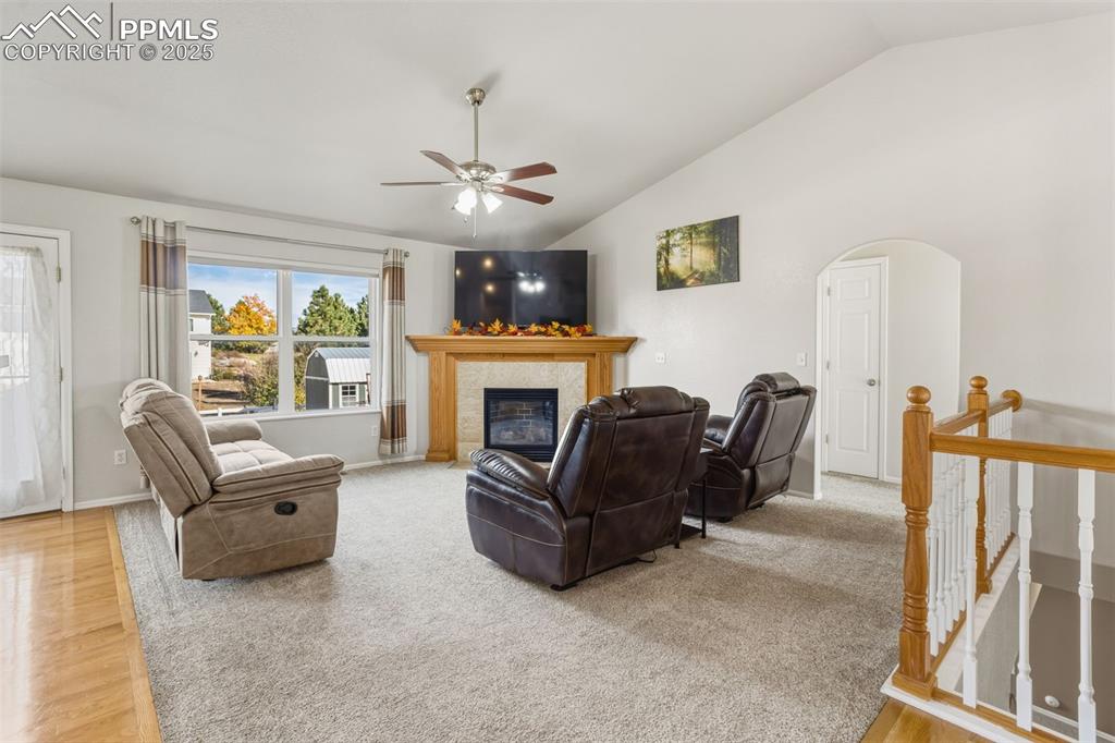 8449 Copenhagen Road Peyton, CO 80831 - Photo 15 of 49 a living room with furniture and a fireplace