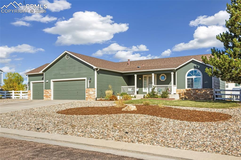 8449 Copenhagen Road Peyton, CO 80831 - Photo 2 of 49 a front view of a house with garden